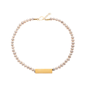 Bella single strand pearl necklace with gold pendant