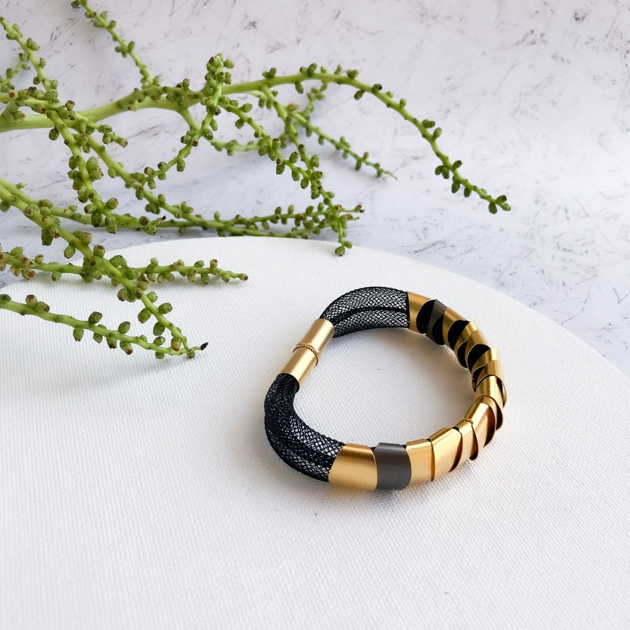 Modern black and gold bracelet